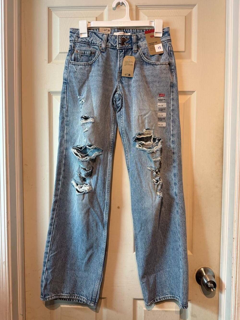 NWT Levis Superlow Loose Size 24x32 Distressed Denim Jeans